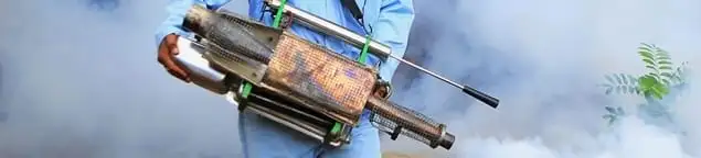 Fumigation technician using a fogger for deep pest treatment in Tempe, AZ